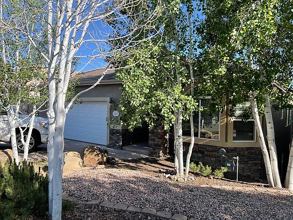 Tree filled low maintenance front yard