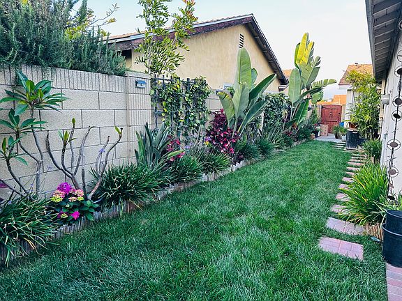Picture taken facing from the end unit looking at the entrance. On the right side there is a door for access to washer and dryer. Also includes small storage space that can store bike.