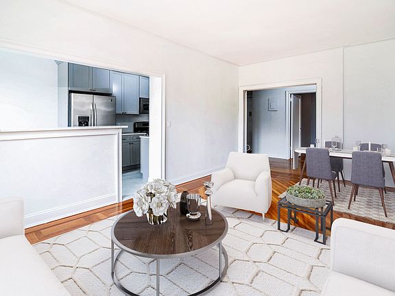 Virtually staged living/dining room facing kitchen