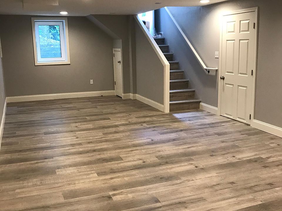 Main room and entrance--egress with stone window well