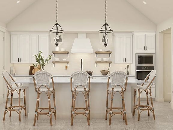 Kitchen with sloped ceiling and pendant lighting