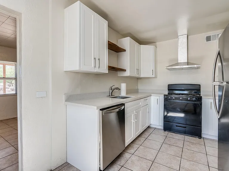 Kitchen with Stainless Steel Appliances (including dishwasher and large refrigerator)