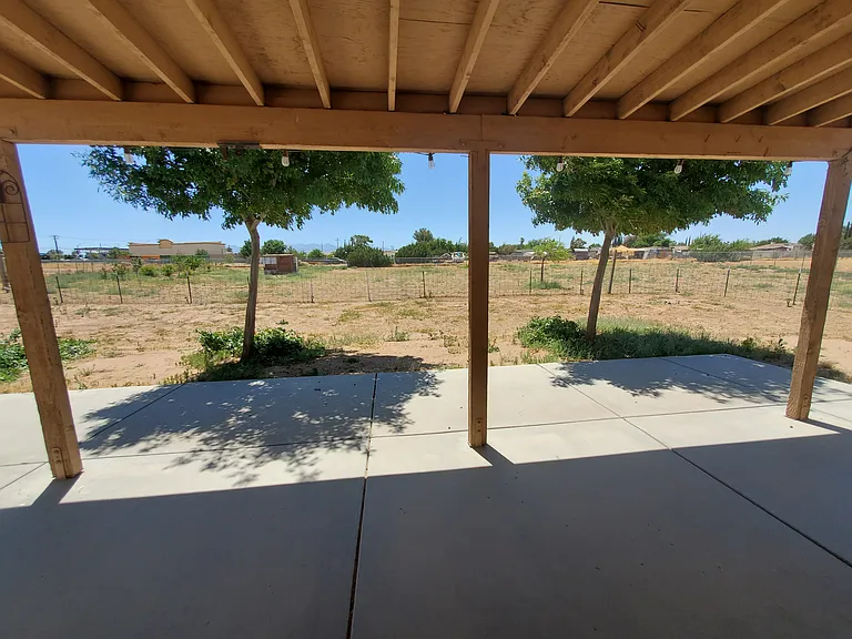 Shaded back patio. Shade trees shade house in the afternoon.