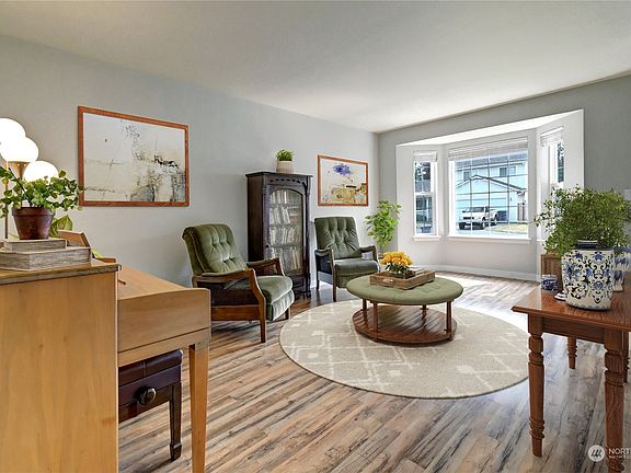 Light and bright living room looks out to the private cul de sac>
