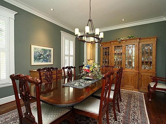 Formal dining with butlers pantry leading to kitchen.