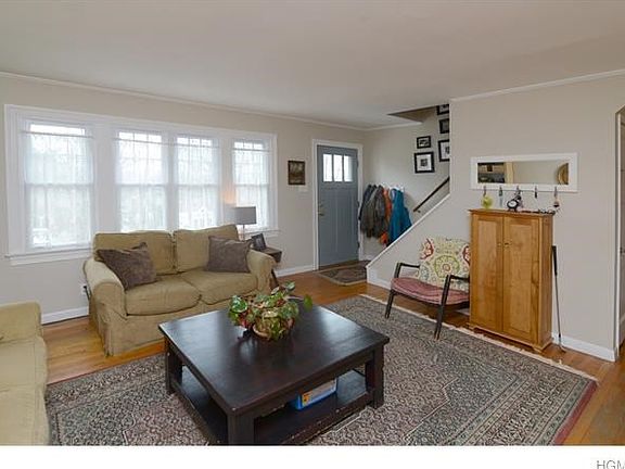 Living room facing front of house.  Bright natural light enhances the room.