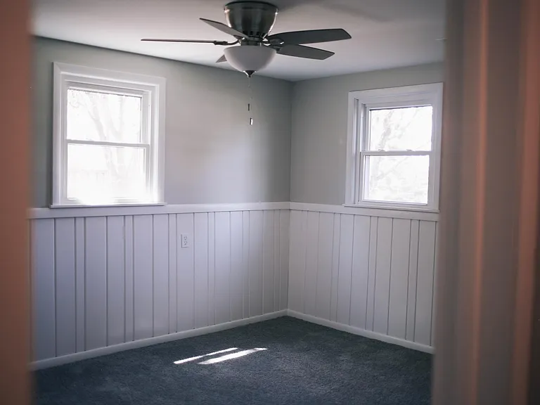 3rd Bedroom on lower level. Receives gorgeous natural light, new carpets and light fixtures were installed in 2019, and has a nice size closet for storage.