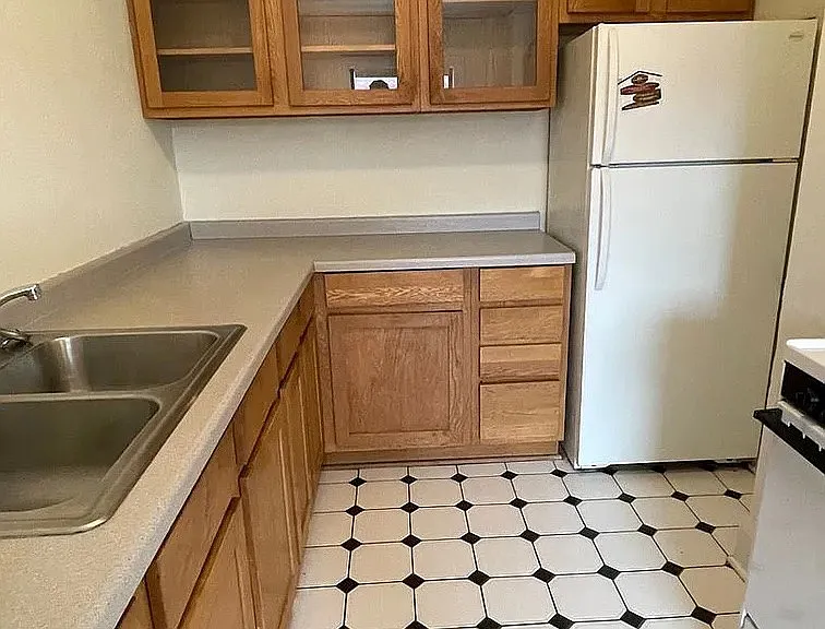 Embrace functionality in the well-designed kitchen of LS Capital Group. Features include ample cabinetry, modern appliances, and sleek countertops, perfect for culinary enthusiasts. Schedule a visit today to envision your new living space!