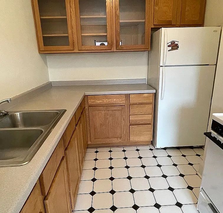 Embrace functionality in the well-designed kitchen of LS Capital Group. Features include ample cabinetry, modern appliances, and sleek countertops, perfect for culinary enthusiasts. Schedule a visit today to envision your new living space!