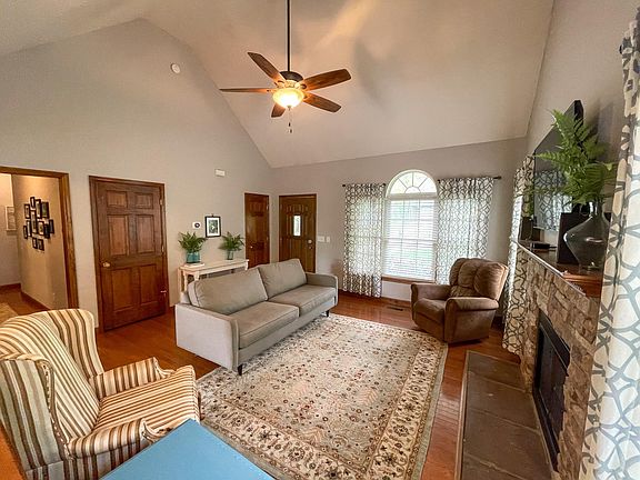 Main Floor Living Area with Vaulted Ceilings, coat closet and storage next to the front door