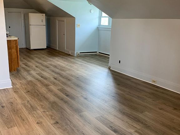 Livingroom opens to kitchen/dining area.