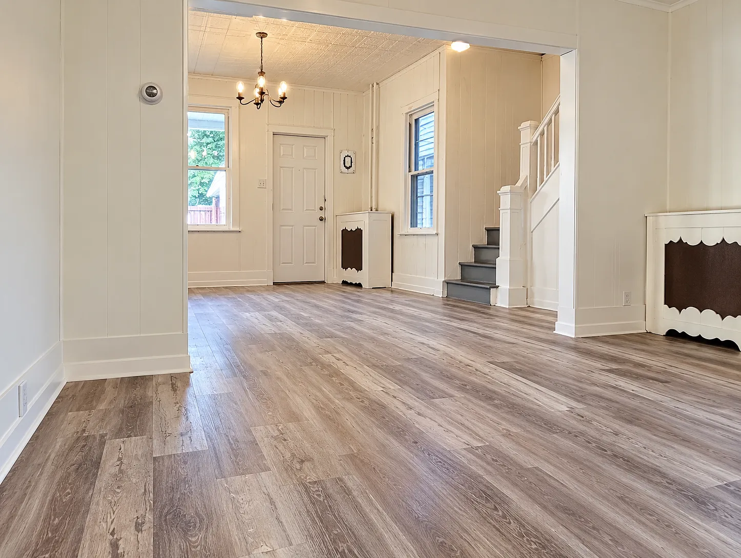 Spacious 4-Bedroom Home with Large Living Areas & Covered Porch — Photo 1