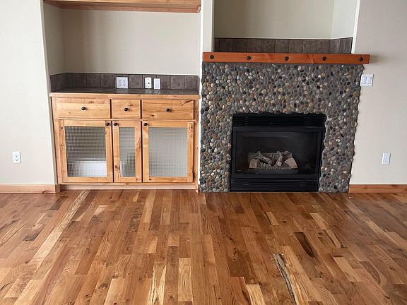 Built in entertainment center and custom gas fireplace.