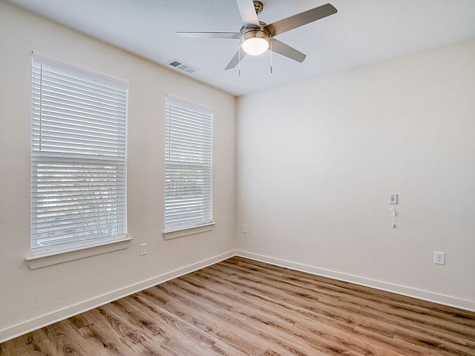 Unit Bedroom with Ceiling Fan and 2 Windows