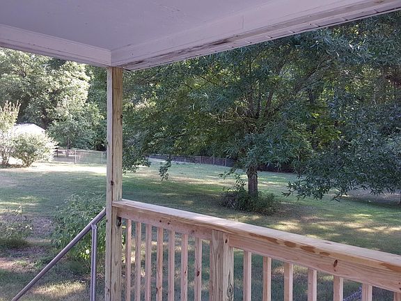 Covered Deck overlooking spacious lot