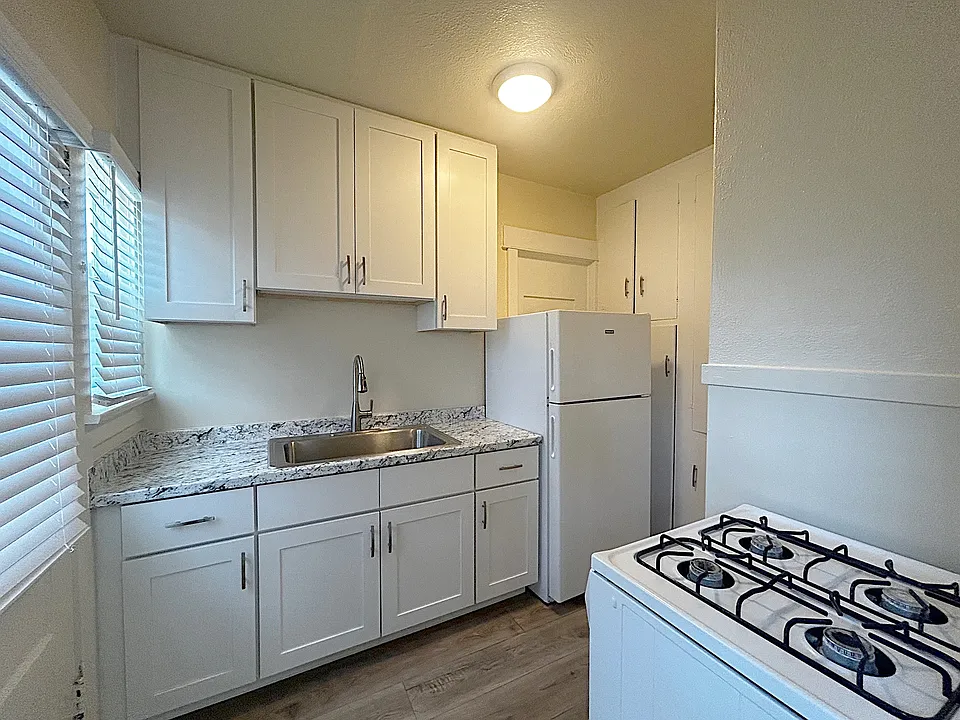 Upgraded kitchen with new soft-close cabinets, new refrigerator and stove.