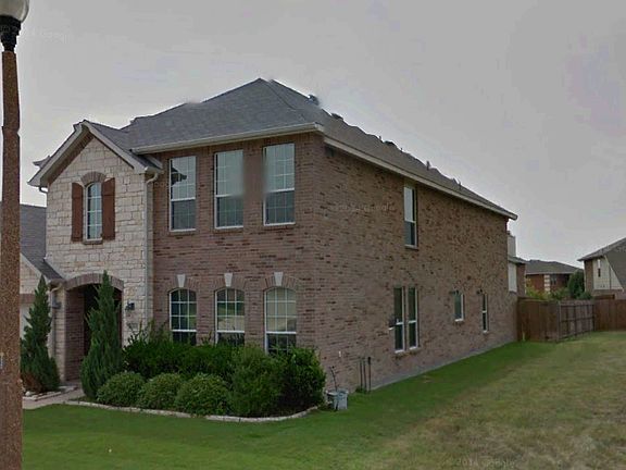 Side view. Next to empty lot