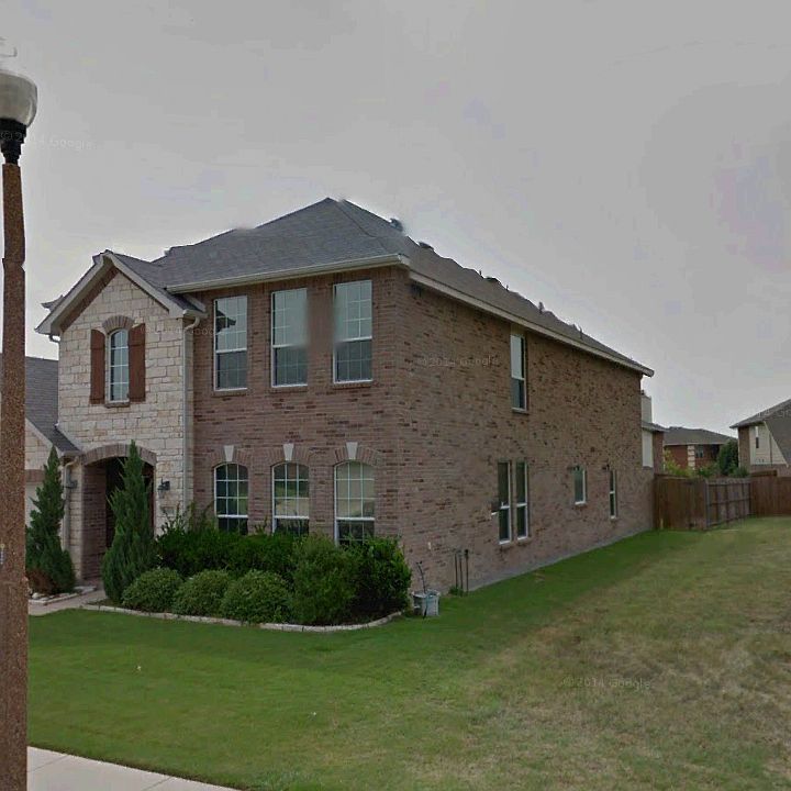 Side view. Next to empty lot