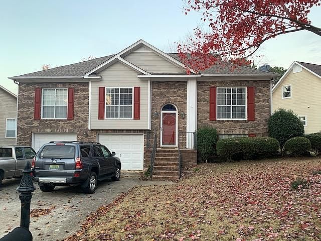 Over the garage, Left end is the Master Bedroom, window outset is the dining room, right end is a front bedroom on top, and below behind the bushes is the downstairs den.