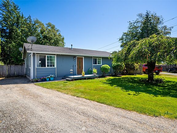 Plenty of parking. Gate opens to large back yard with shop for additional covered parking.