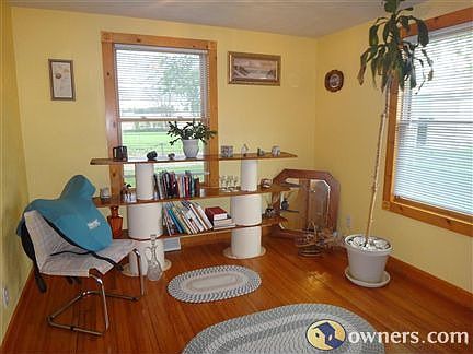 third bedroom, shows wood floor, wood trim