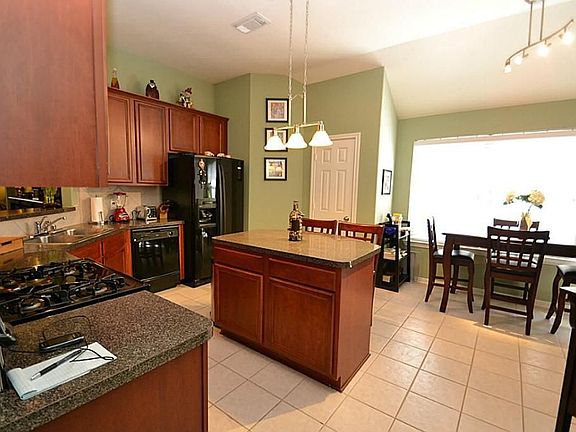 Kitchen opening to breakfast room.