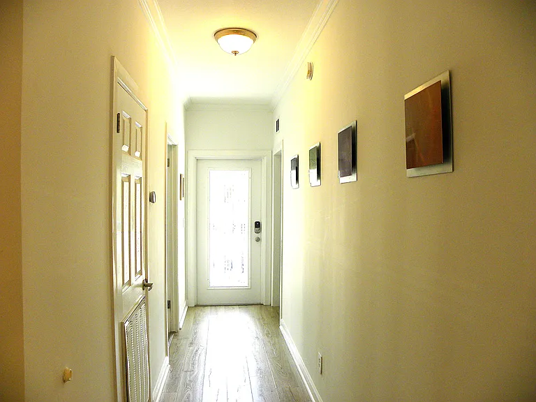 Hallway to Front Door & 1st Floor Bedroom