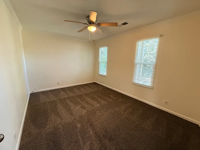 Secondary bedroom with brand new carpet.