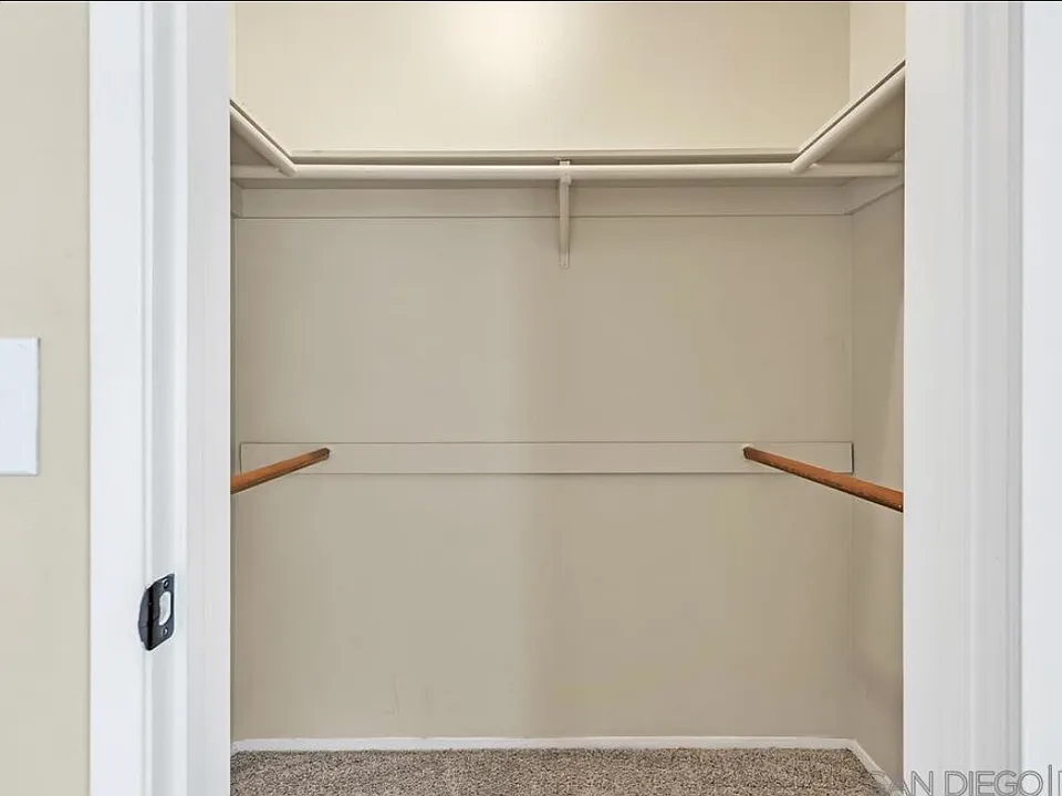 Walk in closet in primary bedroom