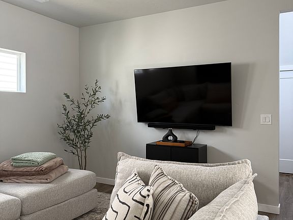 Living Area with 65" Samsung Smart TV and Samsung Sound Bar