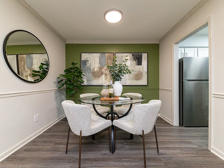 Dining area with hardwood-style flooring & overhead lighting