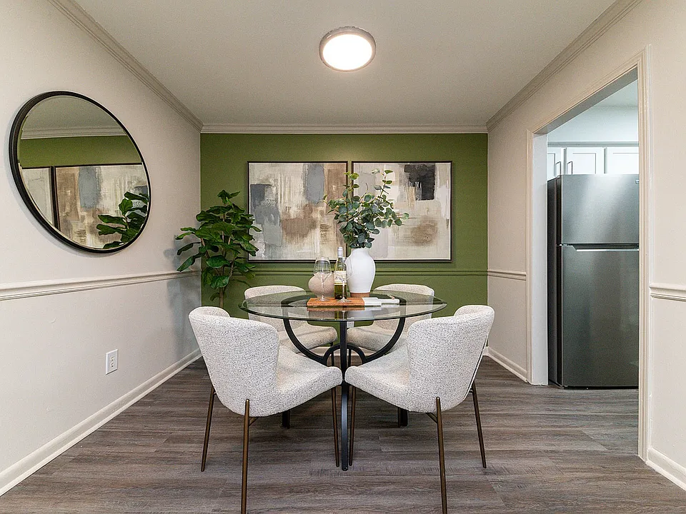 Dining area with hardwood-style flooring & overhead lighting