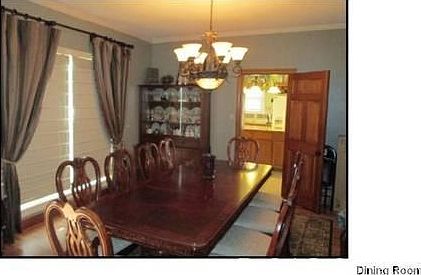 Large Formal Dining Room
						:
						Updated draperies and lighting