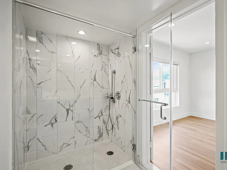 Bathroom with Large-Size Shower with a Glass Door
