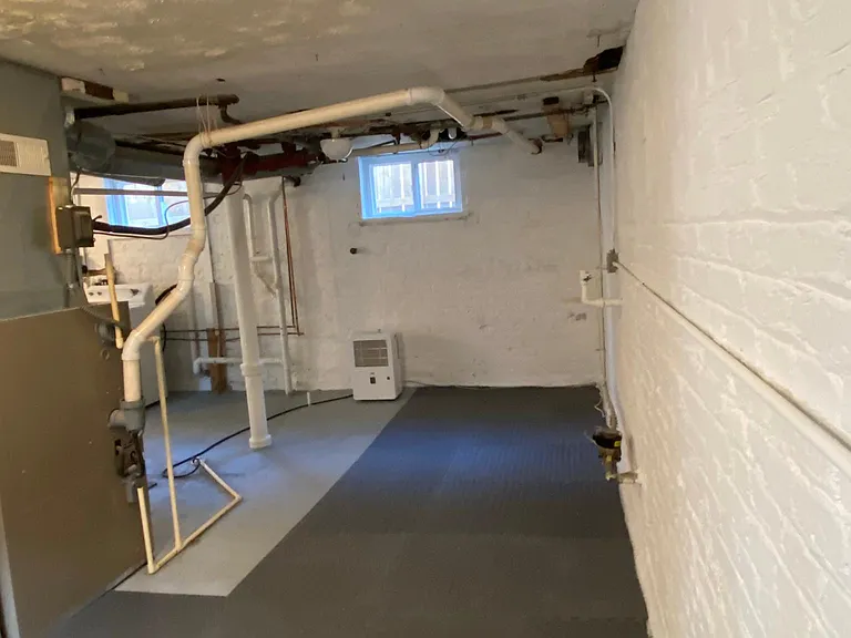 Clean, dry, bright basement with washer/dryer. Nice area for workout equipment or storage area.
