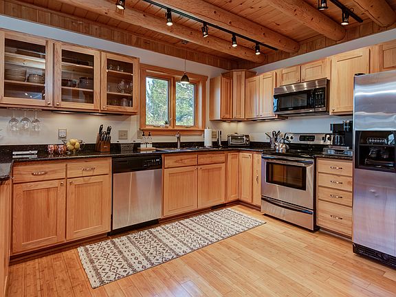 2nd floor, main level: Living room with queen-sized sleeper sofa, 55" Roku HDTV, full stocked kitchen with gas stove, dishwasher, full-sized refrigerator, breakfast nook, full bathroom.