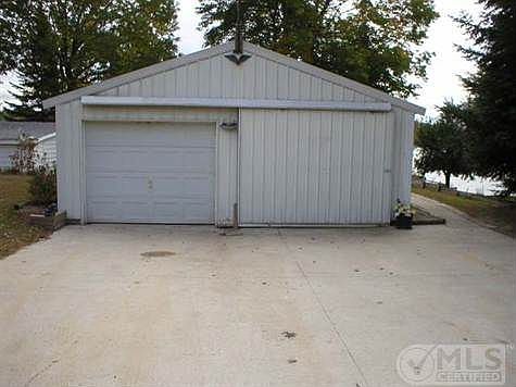 2-car garage with concrete driveway.