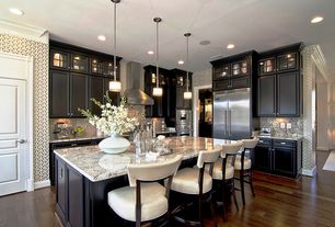 Transitional Kitchen with Pendant Light, Crown molding, Jessica Charles Fine upholstered barstool, Raised panel, Glass panel