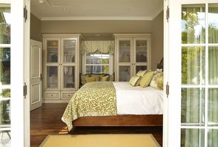 Traditional Guest Bedroom with Glass front cabinets, Stanley Avalon Heights Panel Bed, Hardwood floors, Ceiling molding