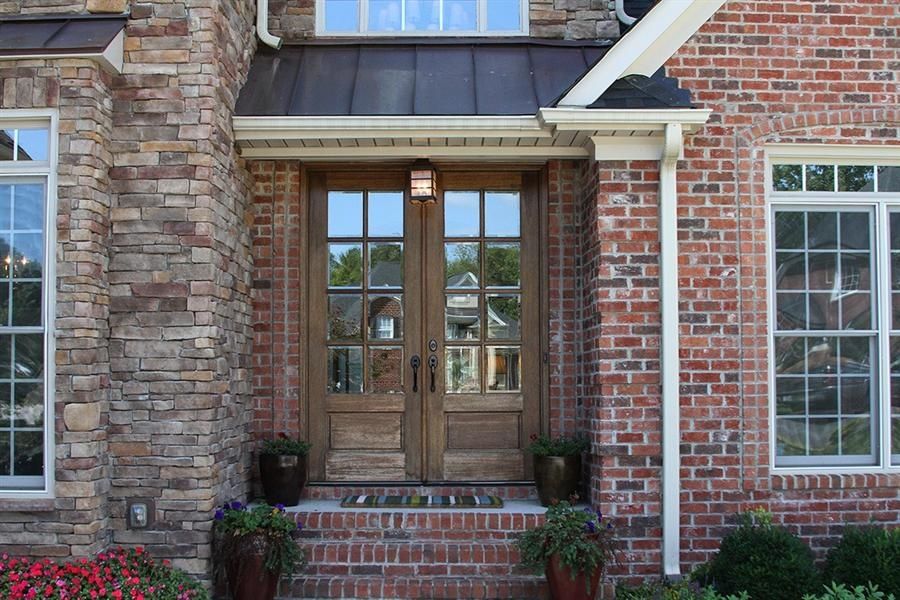 Craftsman Front Door with Raised beds & exterior brick floors in ...