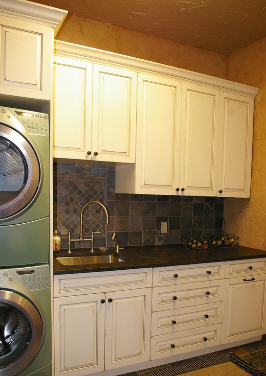 Traditional Laundry Room with Quartz countertop by Randy Thelen
