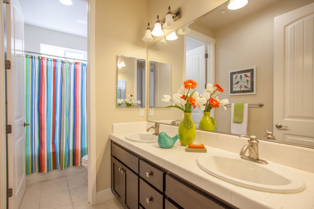 Eclectic Kids Bathroom with limestone tile floors by Julie ...