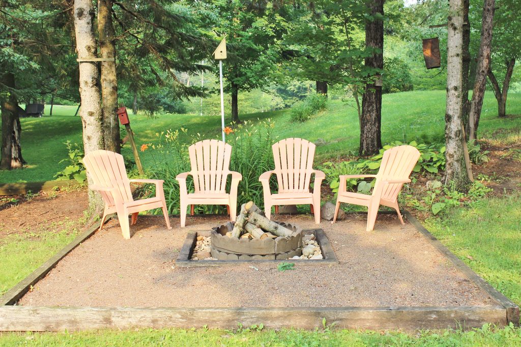 Cottage Landscape and Yard with exterior stone floors & Fire pit in