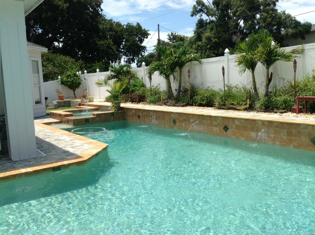 Pool Beds traditional swimming pool with exterior stone floors & raised beds Pool Beds traditional swimming pool with exterior stone floors & raised beds