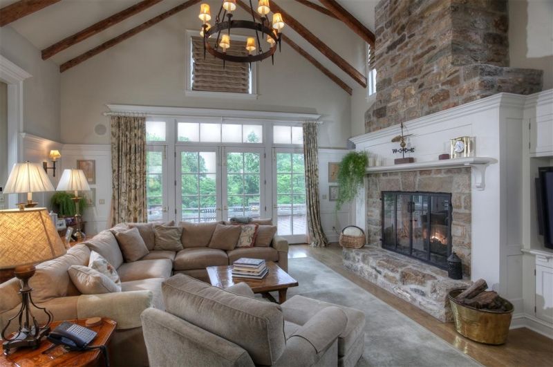 Traditional Living Room with Wall sconce & stone fireplace | Zillow