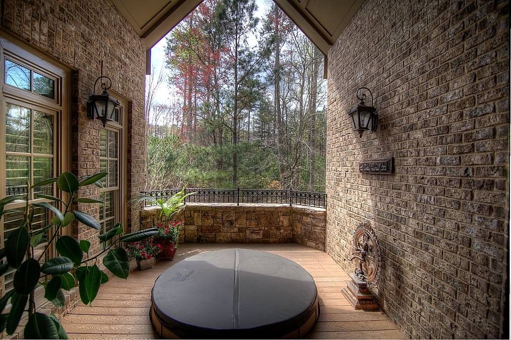 Country Hot Tub with Exterior brick siding by Atlanta Sold Sisters