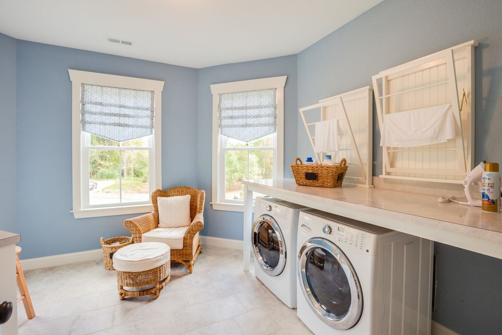 Cottage Laundry Room with limestone tile floors by Stephen Alexander ...