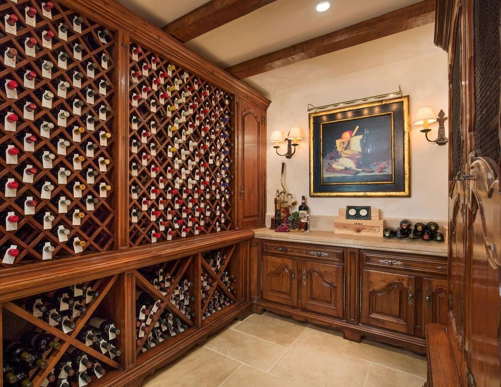Traditional Wine Cellar with High ceiling & Wall sconce in PEBBLE BEACH