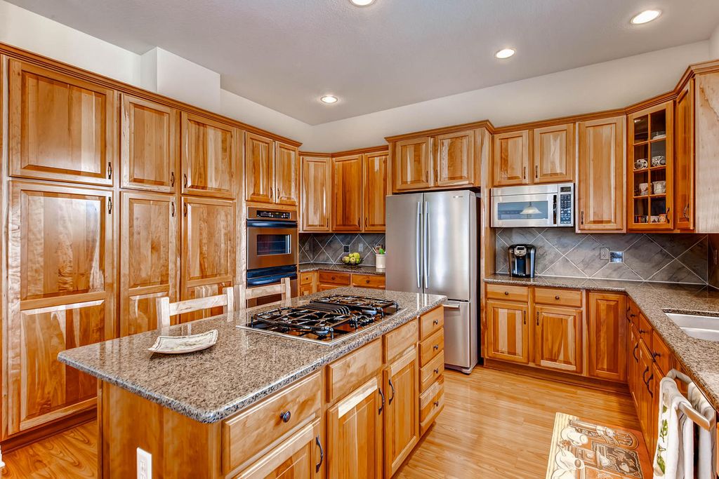 Craftsman Kitchen with Slate Tile & Breakfast bar in Castle Rock, CO