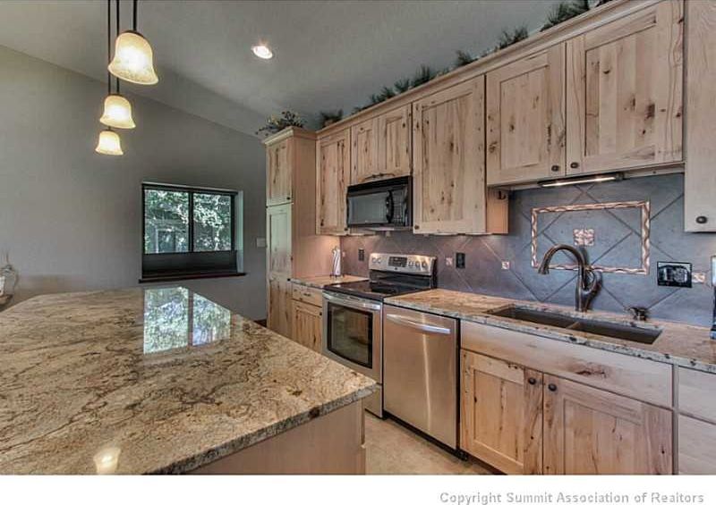 Rustic Kitchen With High Ceiling Flat Panel Cabinets In Dillon Rustic Kitchen With Pendant Light Daltile Porcelain Tile Continental Slate Series Persian Gold